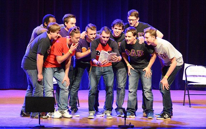 Group of students per为ming on stage during 希腊 唱